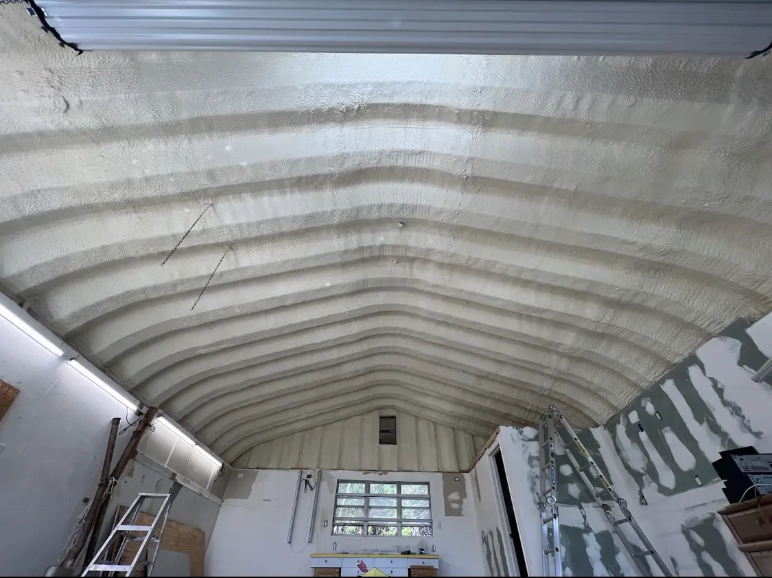 Spray polyurethane foam applied to the underside of a metal roof deck in East Fallowfield